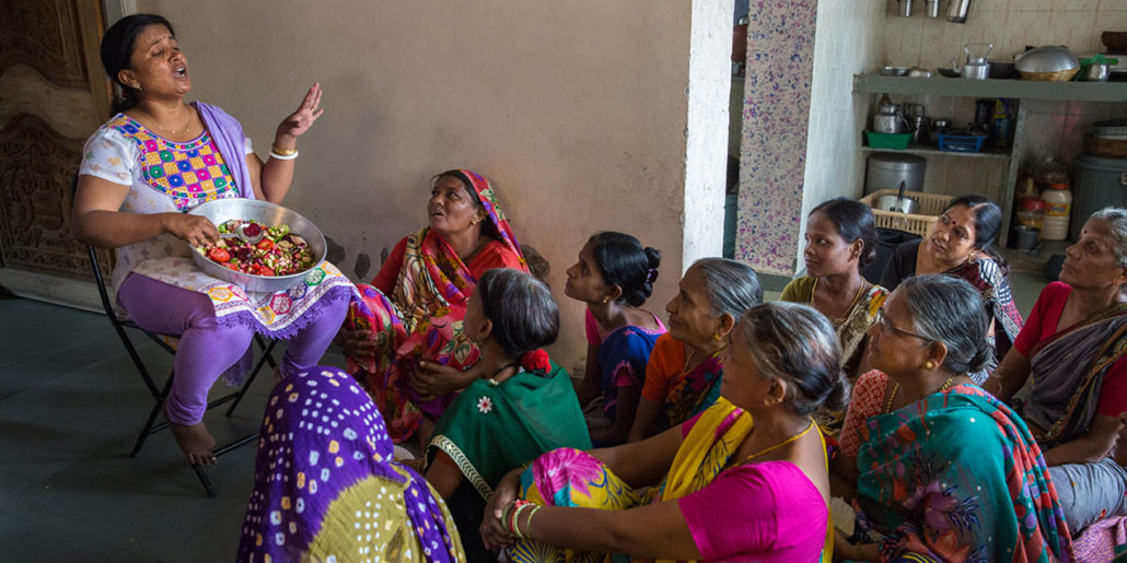 Mothers gather for a nutrition program in Ahmedabad, India