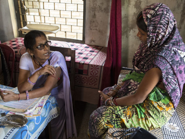 An auxiliary midwife nurse provides medical care to women at a rural health center