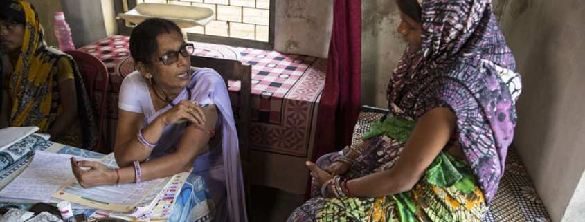 An auxiliary midwife nurse provides medical care to women at a rural health center
