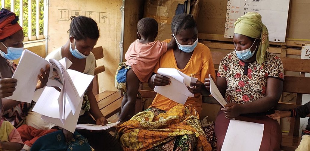 Caregivers participate in user testing solutions for sick child feeding in the DRC.